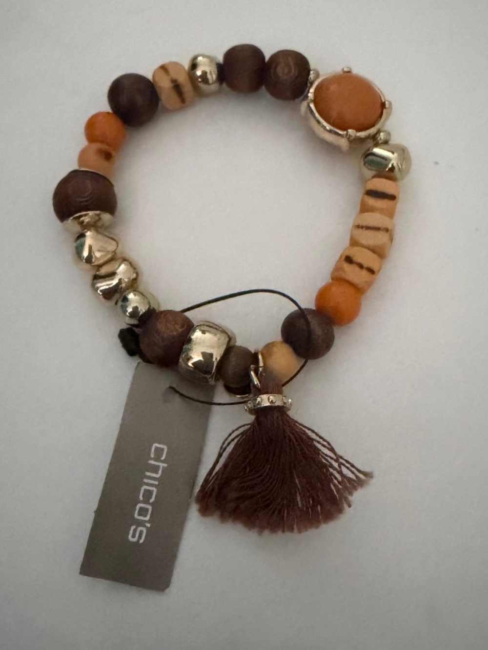 Chico’s Presley stretchy, beaded bracelet with tassel.